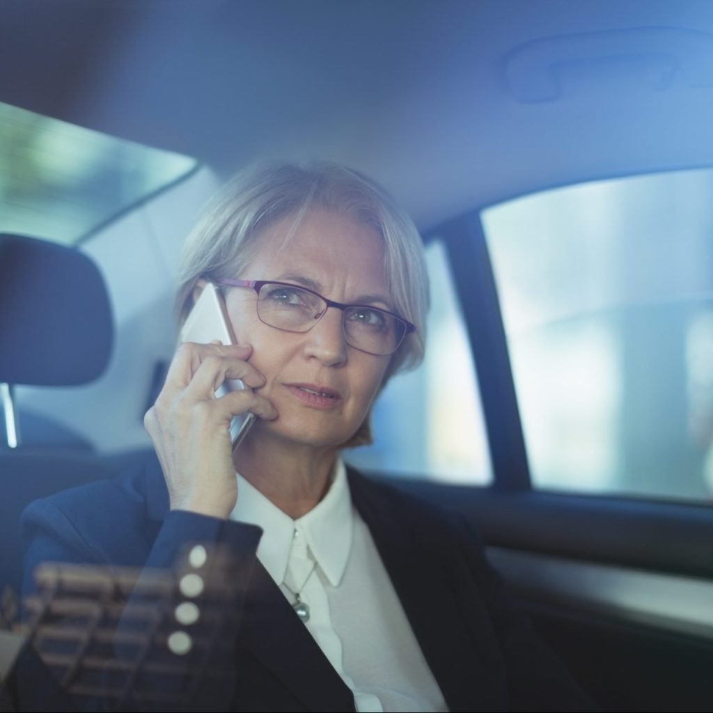 businesswoman talking on phone in car 2021 08 28 16 46 02 utc e1671511196563