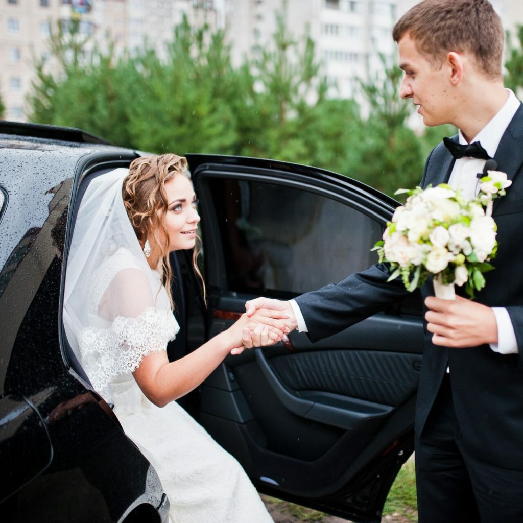 groom and bride near wedding car 2021 09 02 12 44 44 utc e1671510559422