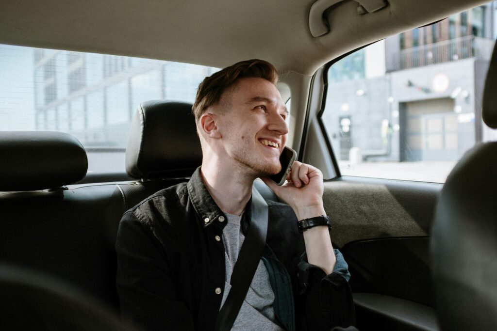 backseat passenger on the phone